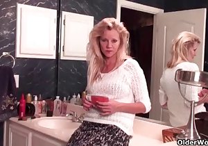 Blond-haired mommy teasing with her stockings