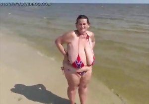 Take a look at these gigantic melons of a hot brunette