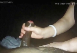 Asian chick with big boobs strokes a nice black penis